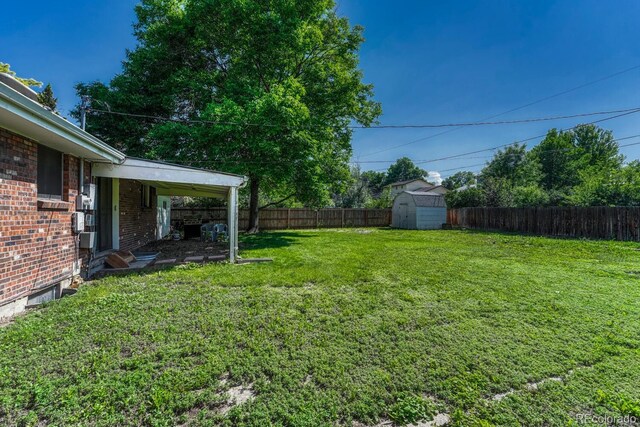 7479 Pierce St, Arvada, CO 80003 - fenced backyard with a storage shed