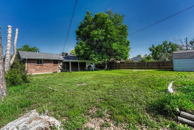 7479 Pierce St, Arvada, CO 80003 - view of yard with a storage shed