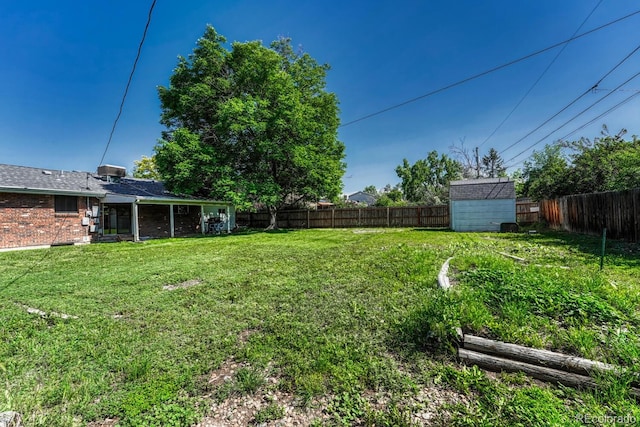 7479 Pierce St, Arvada, CO 80003 - fenced backyard featuring a storage shed