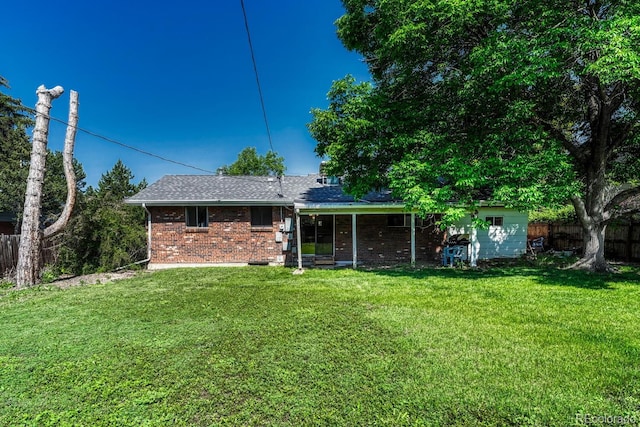 7479 Pierce St, Arvada, CO 80003 - rear view of house with brick siding and roof with shingles