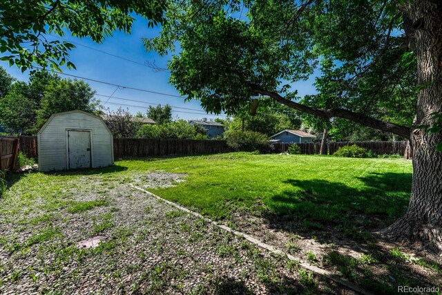 7479 Pierce St, Arvada, CO 80003 - fenced backyard featuring a shed