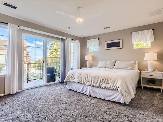 carpeted bedroom with access to exterior and visible vents