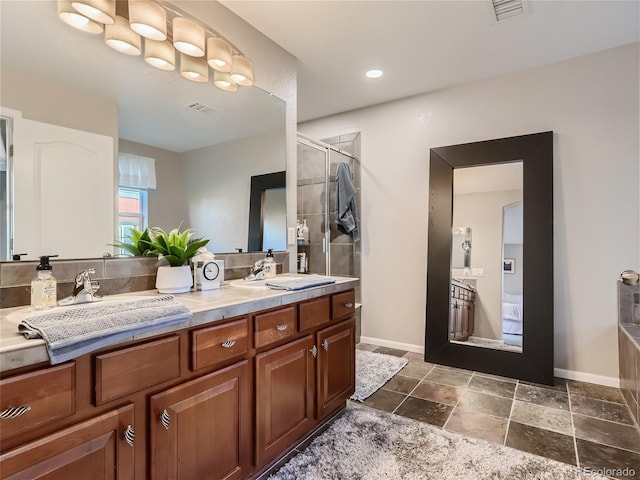 full bath featuring double vanity, a stall shower, a sink, and visible vents