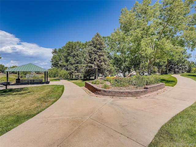 surrounding community featuring a gazebo and a yard