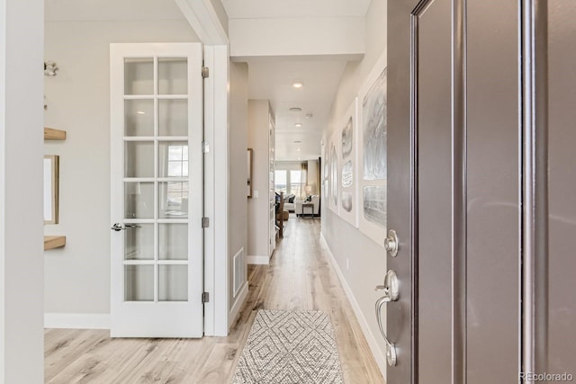17719 Prairie Peak Trl, Parker, CO 80134 - corridor featuring light wood finished floors and baseboards