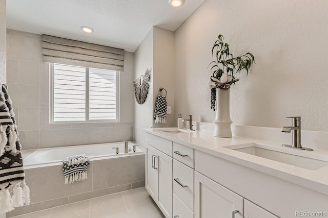 17719 Prairie Peak Trl, Parker, CO 80134 - full bath featuring a bathtub, tile patterned flooring, double vanity, and recessed lighting