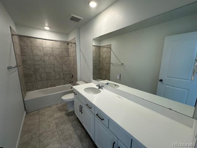 17719 Prairie Peak Trl, Parker, CO 80134 - full bathroom featuring vanity, shower / bath combination, and recessed lighting