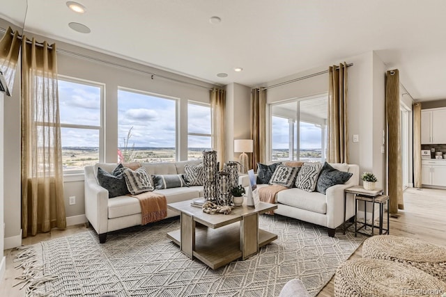 17719 Prairie Peak Trl, Parker, CO 80134 - living room featuring recessed lighting and light wood finished floors