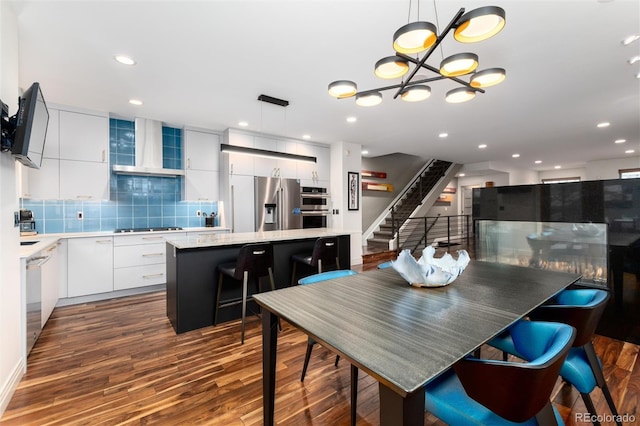 dining space with dark hardwood / wood-style floors