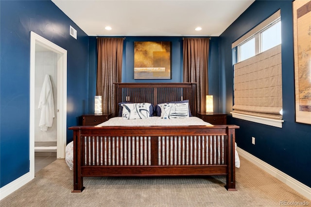 carpeted bedroom with connected bathroom