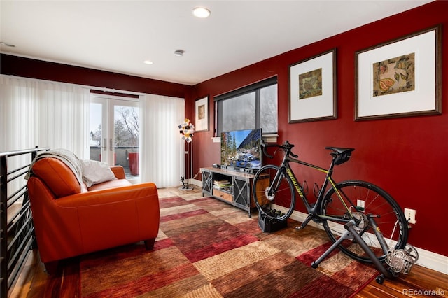 interior space with french doors and hardwood / wood-style flooring