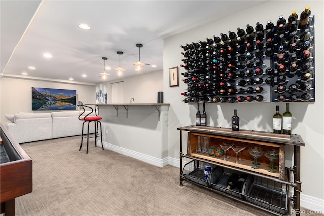 wine room with bar area and light carpet