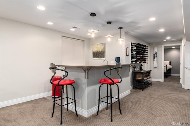 bar with light colored carpet and decorative light fixtures