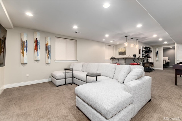 carpeted living room featuring bar