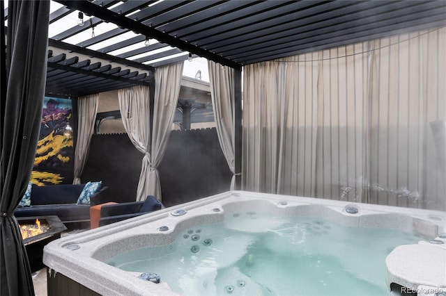 view of patio / terrace featuring a hot tub and a pergola