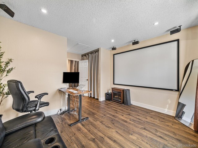 1247 S Idalia St, Aurora, CO 80017 - cinema room featuring wood finished floors, a textured ceiling, baseboards, and recessed lighting