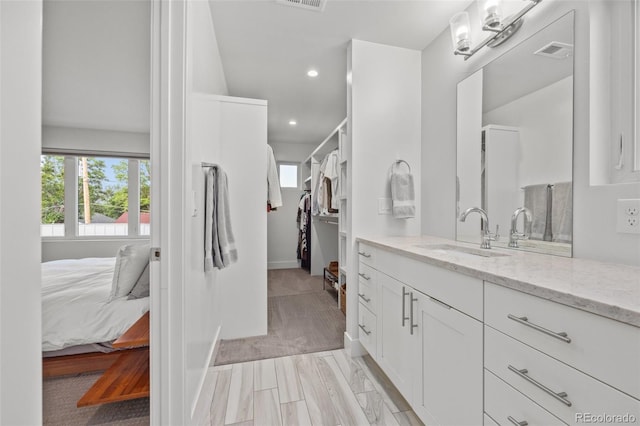 bathroom featuring vanity and plenty of natural light