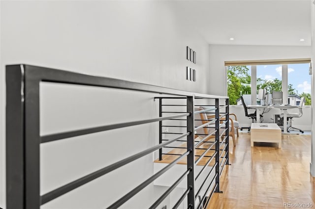 hallway with light hardwood / wood-style floors