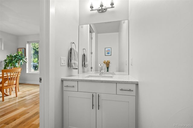 bathroom featuring vanity and hardwood / wood-style flooring