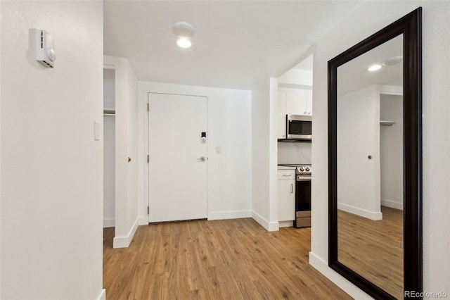 hall featuring light wood-type flooring