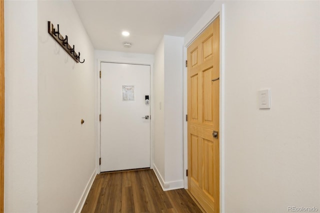 corridor featuring dark hardwood / wood-style floors