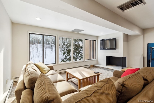 living room with a baseboard radiator and carpet flooring