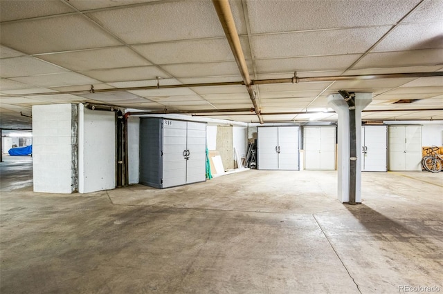 basement featuring a drop ceiling