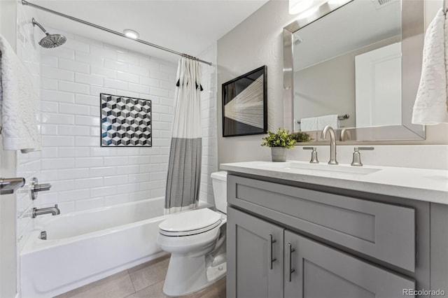 bathroom featuring toilet, tile patterned floors, shower / bath combination with curtain, and vanity