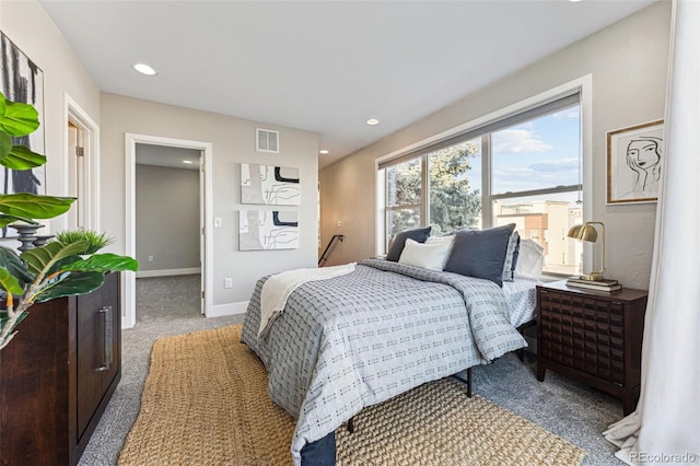 bedroom featuring light carpet, recessed lighting, visible vents, and baseboards