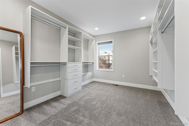 spacious closet with carpet flooring and visible vents