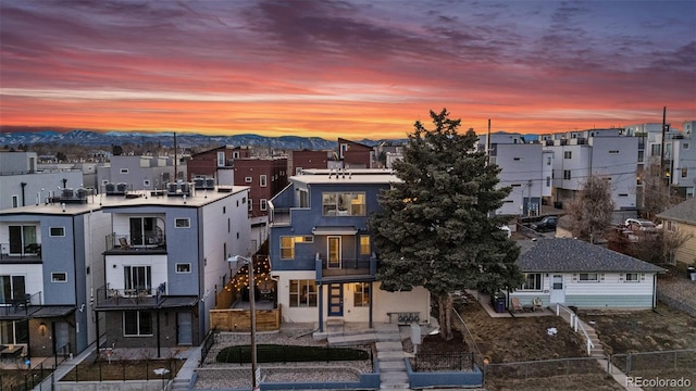 drone / aerial view featuring a residential view and a mountain view