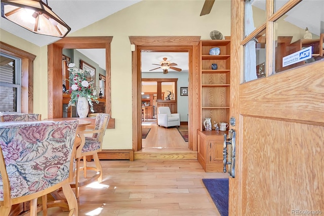 interior space featuring light hardwood / wood-style floors and lofted ceiling