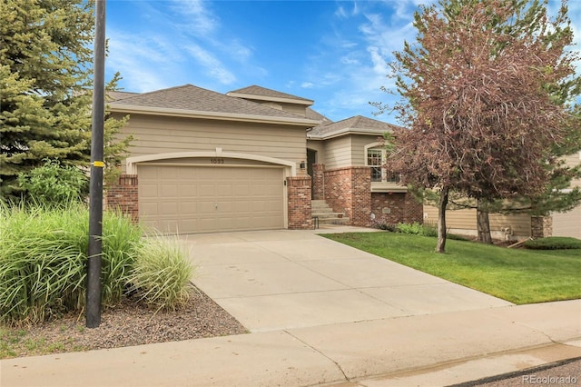 1033 Bramblewood Dr, Castle Pines, CO 80108 - view of front of property featuring brick siding, an attached garage, driveway, and a front yard