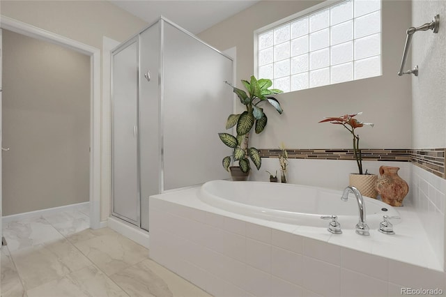 1033 Bramblewood Dr, Castle Pines, CO 80108 - bathroom featuring a shower stall, a bath, and marble look tiles