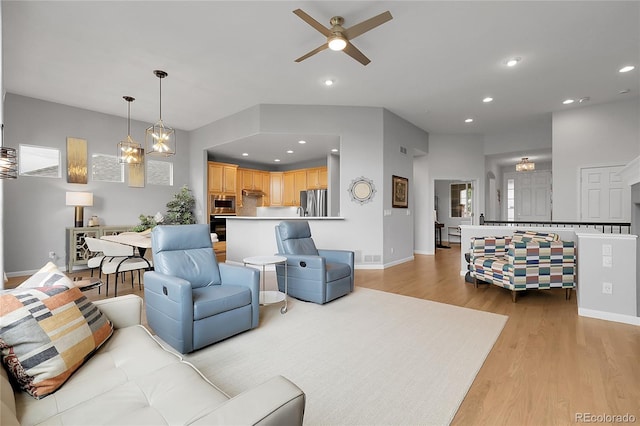 1033 Bramblewood Dr, Castle Pines, CO 80108 - living room featuring light wood-style floors, a ceiling fan, and recessed lighting