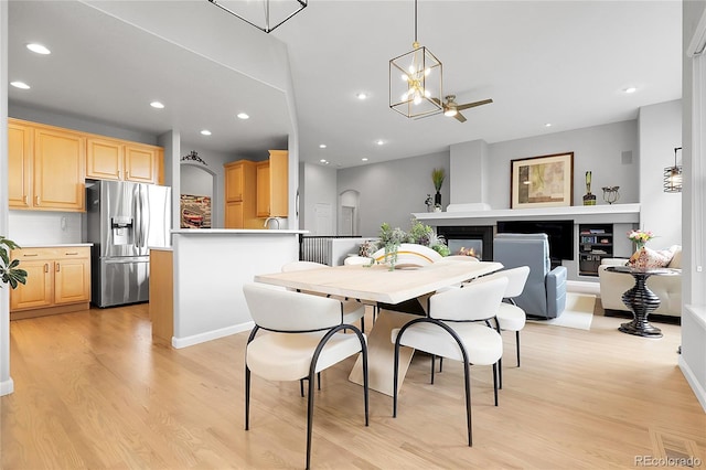 1033 Bramblewood Dr, Castle Pines, CO 80108 - dining space featuring light wood-type flooring, a chandelier, and recessed lighting