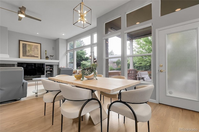 1033 Bramblewood Dr, Castle Pines, CO 80108 - dining space with light wood-style floors, a chandelier, and recessed lighting