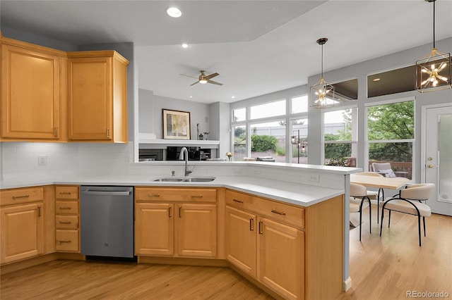 1033 Bramblewood Dr, Castle Pines, CO 80108 - kitchen with stainless steel dishwasher, healthy amount of natural light, a peninsula, light wood finished floors, and recessed lighting
