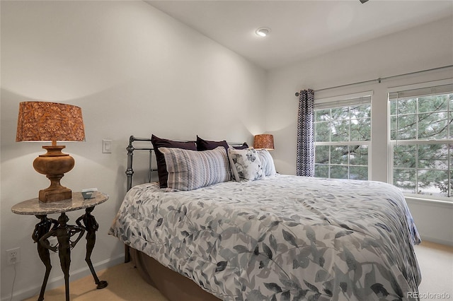 1033 Bramblewood Dr, Castle Pines, CO 80108 - carpeted bedroom with multiple windows and lofted ceiling