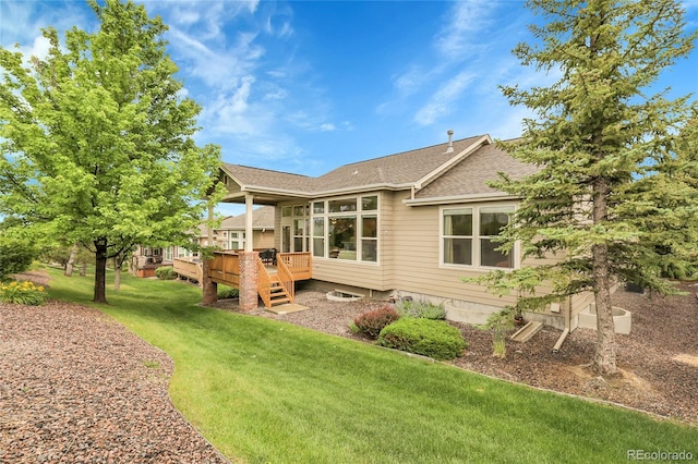 1033 Bramblewood Dr, Castle Pines, CO 80108 - back of house featuring a wooden deck, roof with shingles, a lawn, and a sunroom