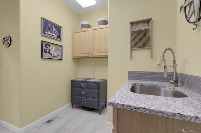 1033 Bramblewood Dr, Castle Pines, CO 80108 - kitchen featuring light brown cabinets and light stone counters