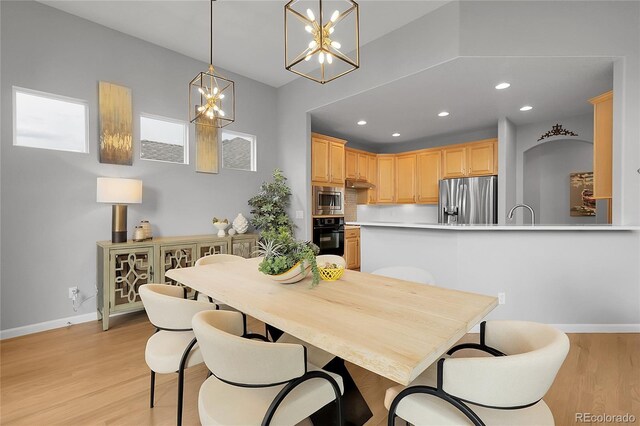1033 Bramblewood Dr, Castle Pines, CO 80108 - dining area featuring a chandelier, light wood-style floors, and recessed lighting