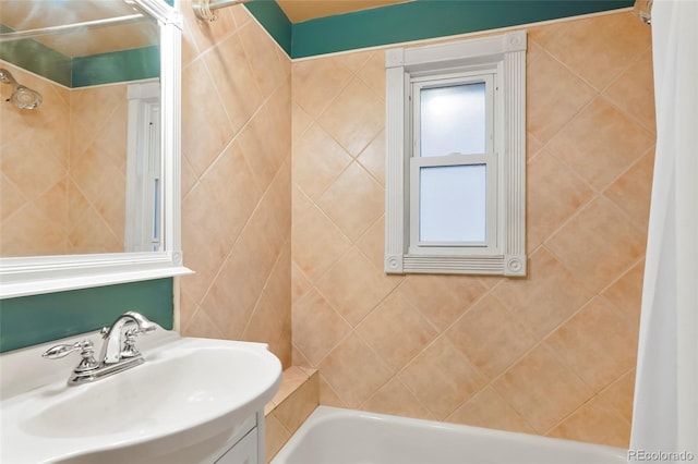 4210 S Fox St, Englewood, CO 80110 - bathroom featuring a sink and shower / bath combination with curtain