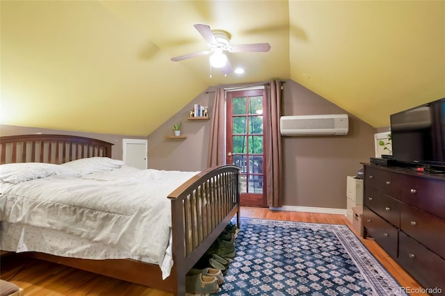 4210 S Fox St, Englewood, CO 80110 - bedroom with a wall unit AC, wood finished floors, vaulted ceiling, baseboards, and ceiling fan