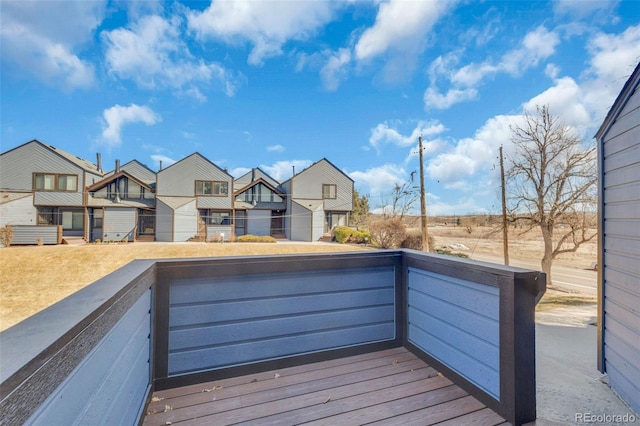 wooden deck with a residential view