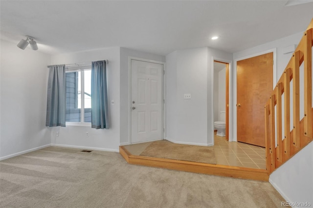 8911 W Yale Ave, Lakewood, CO 80227 - interior space featuring light carpet, baseboards, and visible vents