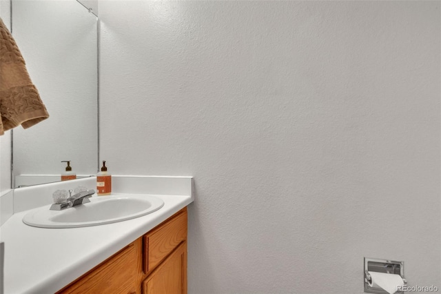 8911 W Yale Ave, Lakewood, CO 80227 - bathroom with a textured wall and vanity