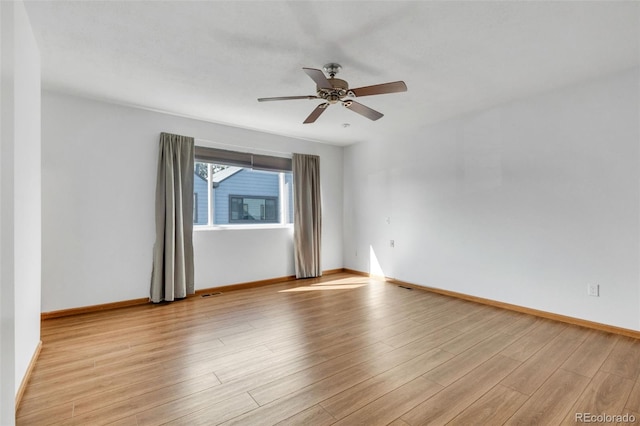 8911 W Yale Ave, Lakewood, CO 80227 - spare room with visible vents, light wood finished floors, a ceiling fan, and baseboards