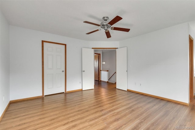 8911 W Yale Ave, Lakewood, CO 80227 - unfurnished bedroom featuring light wood-style flooring, baseboards, and ceiling fan