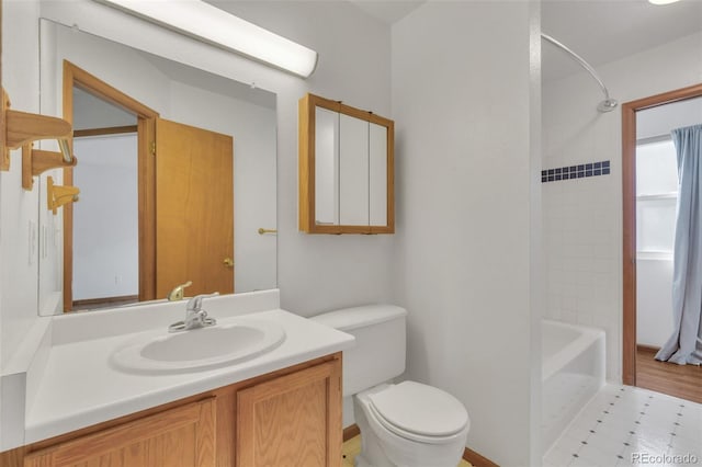 8911 W Yale Ave, Lakewood, CO 80227 - full bathroom with toilet, shower / bathtub combination, and vanity